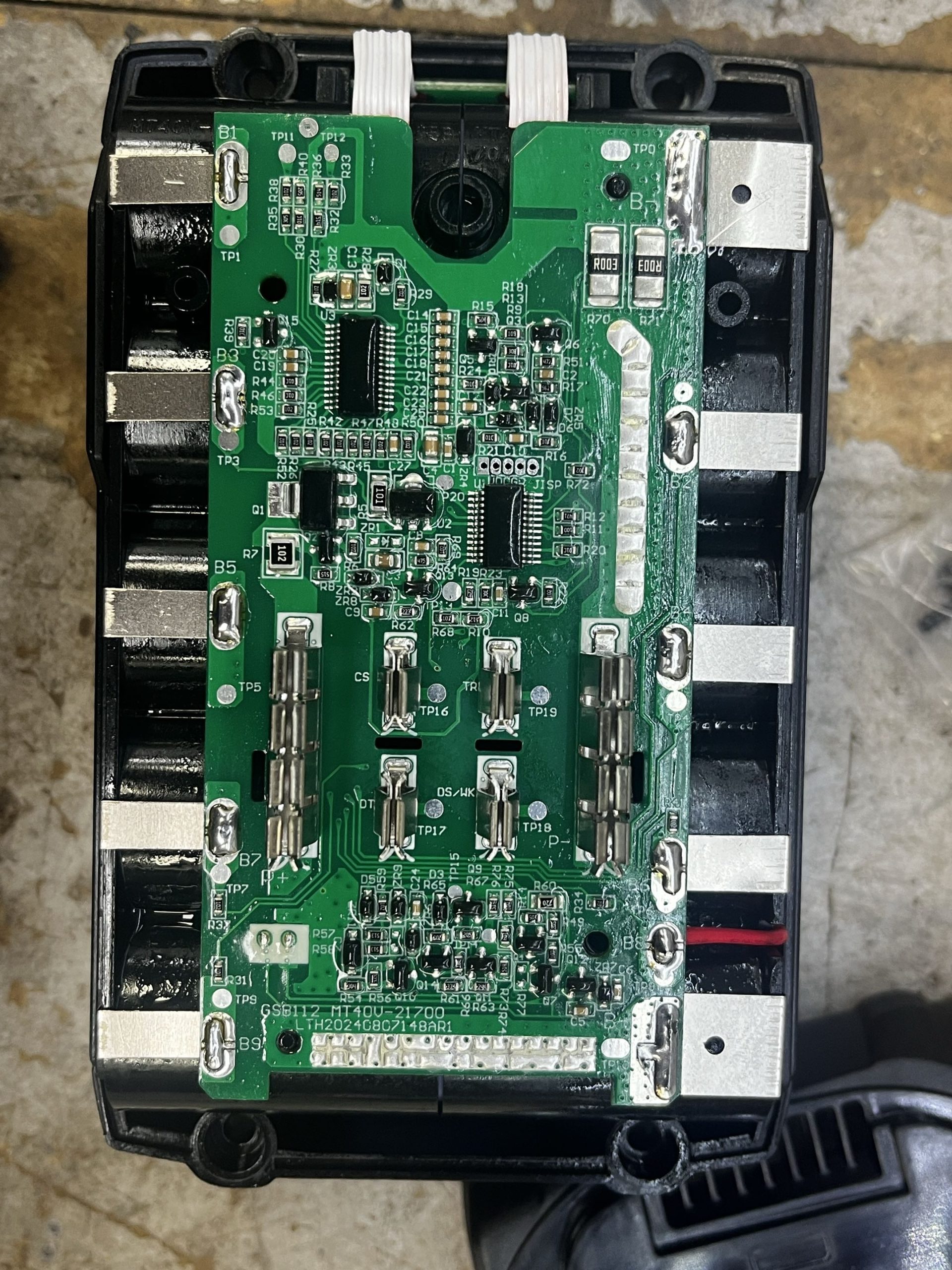 Makita 40V XGT BMS circuit board marked MT40V-21700 showing soldering points and components